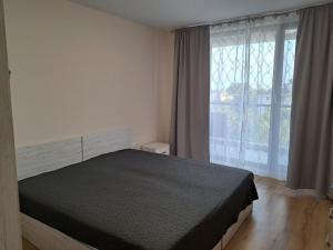 Postel nebo postele na pokoji v ubytování Апартамент Deluxe 7 + 37 fotografií