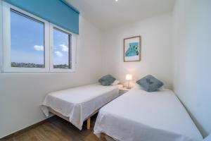 Posteľ alebo postele v izbe v ubytovaní Don Pepe Chic Apartment by Rock Rentals + 26 fotografií