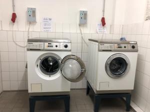 two washing machines in a laundry room at Stromstr_2 _Boddenblick_ Whg_26 in Zingst