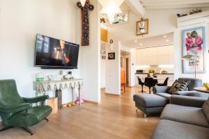 Televízia a/alebo spoločenská miestnosť v ubytovaní Matteotti Apartment