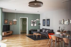 a living room with a couch and a table at The Circus Apartments in Berlin