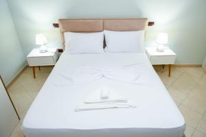 Posteľ alebo postele v izbe v ubytovaní Aldesa Apartments