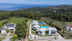 an aerial view of a house with a large yard at Blue Avenue in Paliouri