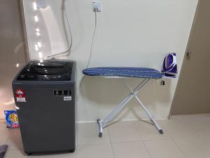 a stool next to a trash can and a chair at Fiyyadh Homestay Gambang in Gambang +2 photos