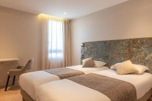 Posteľ alebo postele v izbe v ubytovaní Hôtel d'Angleterre Rouen Centre Gare