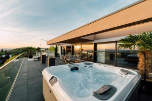 a hot tub on the roof of a house at Traumblick trifft Luxus! in Weitersburg