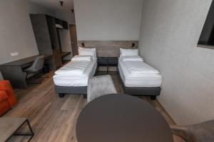 Postel nebo postele na pokoji v ubytování Hotel Halond
