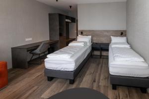 Postel nebo postele na pokoji v ubytování Hotel Halond