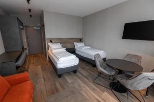 Postel nebo postele na pokoji v ubytování Hotel Halond