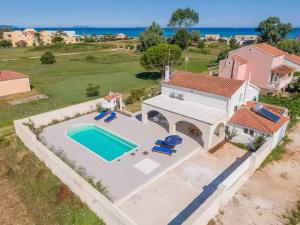 an aerial view of a house with a swimming pool at Sea Breeze Coastal House in Almyros Beach in Almiros Beach
