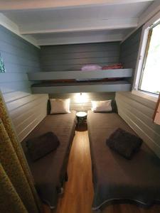Ένα ή περισσότερα κρεβάτια σε δωμάτιο στο Chalet calme et agréable +13 φωτογραφίες