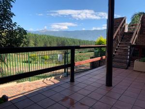 a balcony with a view of the mountains at Majestic View Self Catering Guest House in Sabie