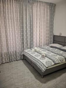 a bedroom with a large bed with a curtain at Beautiful apartment in the center ofJerusalem 4 in Jerusalem