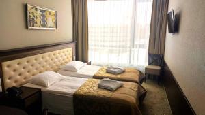 Postel nebo postele na pokoji v ubytování Grand SPA Lietuva Hotel Lietuva