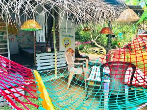 a group of hammocks in front of a house at Sigiriya Homestay in Sigiriya