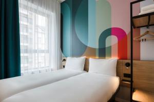 Postel nebo postele na pokoji v ubytování B&B HOTEL Mechelen