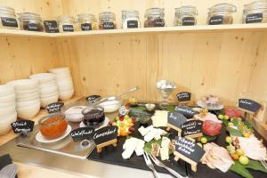 a table with food on it in a kitchen at Feriengut zum Fürst´n in Eppenschlag