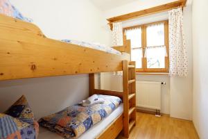 Postel nebo postele na pokoji v ubytování Feriengut zum Fürst`n mit Außenwhirlpool und Sauna