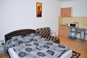 Posteľ alebo postele v izbe v ubytovaní SovaApartman