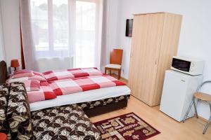 Posteľ alebo postele v izbe v ubytovaní SovaApartman