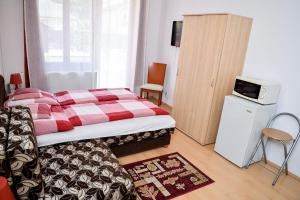 Posteľ alebo postele v izbe v ubytovaní SovaApartman