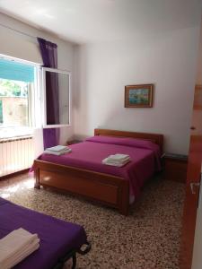 Ένα ή περισσότερα κρεβάτια σε δωμάτιο στο Casa da Fiorella