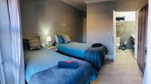 Кровать или кровати в номере Hermanus Guest Rooms