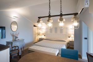 a bedroom with a bed and a table and chairs at AD MY HOME in Cortona +111 photos