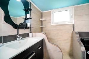 a bathroom with a sink and a mirror at Olivendra Thassos in Prinos +26 photos