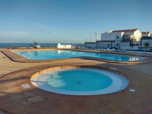 a large swimming pool on top of a building at Sunny Bungalow in Caleta De Fuste