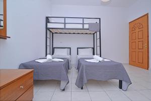 Posteľ alebo postele v izbe v ubytovaní Apartments Kalina