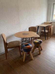 a room with two tables and chairs and a table at Era Home in Murg