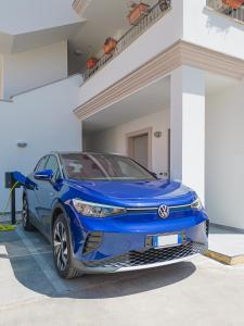 a blue toyota camry parked in a garage at The Park View Place in Olbia