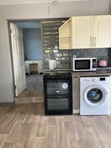 Kuchyň nebo kuchyňský kout v ubytování Junes cosy apartment