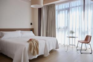 Кровать или кровати в номере Hotel Trina 20 +14 фотографий