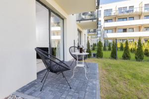 Vonkajšia záhrada v ubytovaní Gdynia Nasypowa Apartments with Parking by Noclegi Renters
