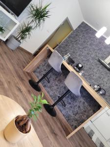 an overhead view of a living room with two chairs at Apartament Pod Orzechem in Bydgoszcz