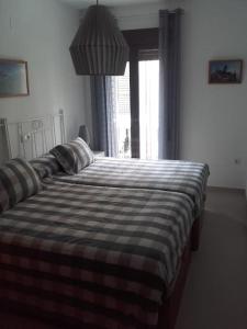 Postel nebo postele na pokoji v ubytování Vivienda vacacional con garaje Vistas a Mágina + 1 fotografie
