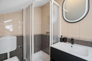 a bathroom with a shower and a sink and a mirror at Villa Lux in Promajna +31 photos