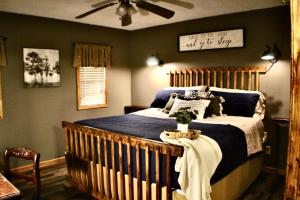 a bedroom with a bed with a wooden crib at Browning Lambert Resort - Hatfield McCoy and Local Off-Road Trails in Rock