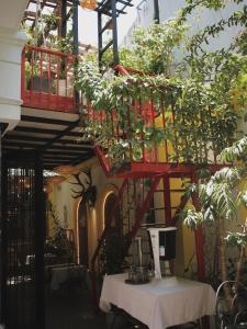 a red staircase with plants on it in a building at The Pergola Design Hotel in Da Nang