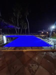 a blue swimming pool at night at CUMBUCO - Eco Paradise - AP 112 in Caucaia