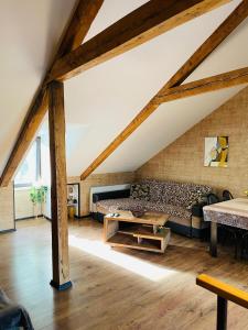 a living room with a couch and a table at Beautiful Apartment on Atoneli in Tbilisi City