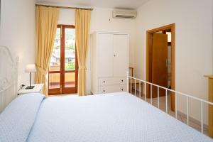 Кровать или кровати в номере Hotel Anna