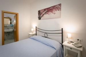 Кровать или кровати в номере Hotel Anna