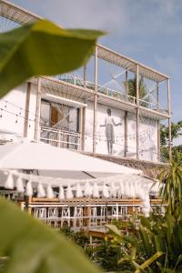 a building with a picture of a man on it at Happiness Hostel Siargao in General Luna