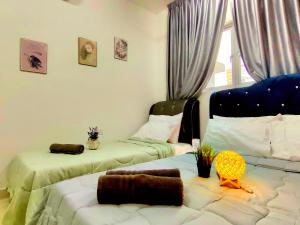 a bedroom with two beds and a window at Alanis Residence 7 Pax @ Sepang KLIA Kota Warisan in Sepang +41 photos