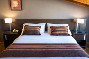 Postel nebo postele na pokoji v ubytování Hotel Crans Montana