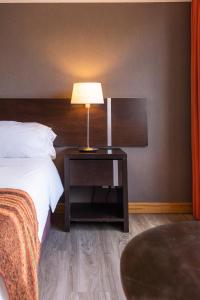 Postel nebo postele na pokoji v ubytování Hotel Crans Montana