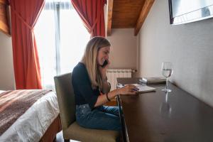 Postel nebo postele na pokoji v ubytování Hotel Crans Montana